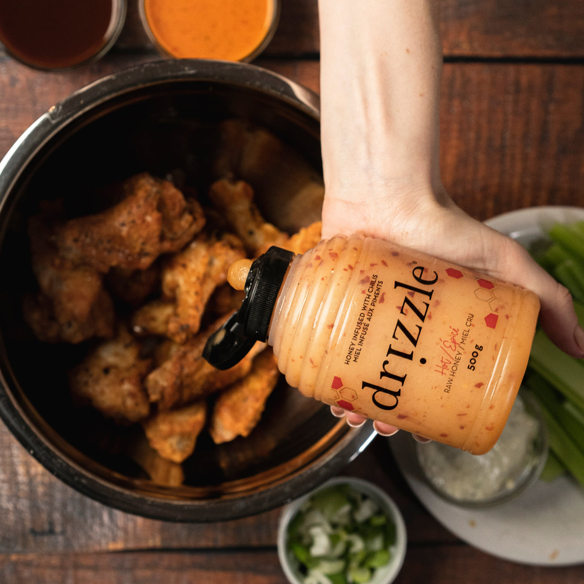 Hot honey drizzling over chicken wings
