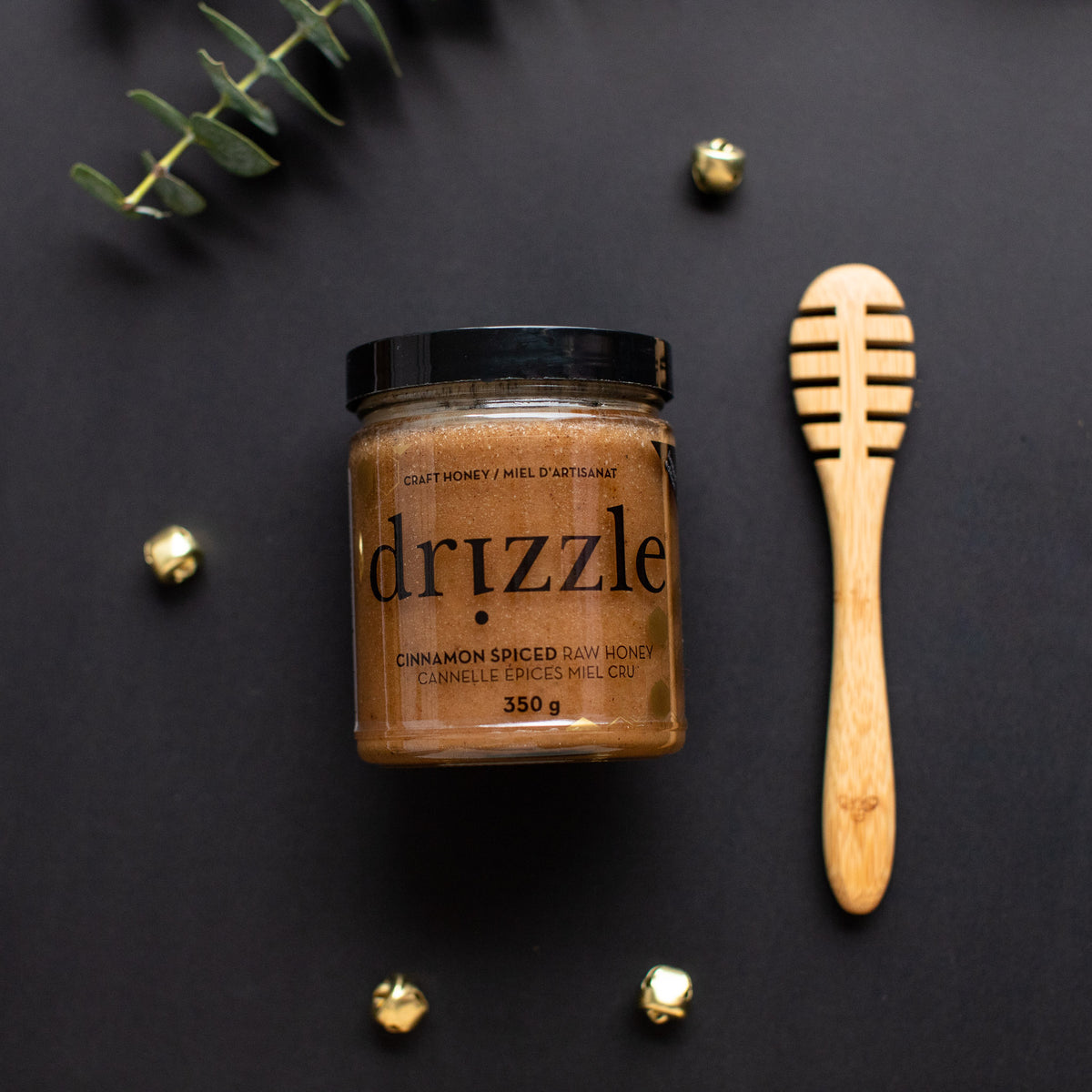 Honey Dipper beside a jar of honey