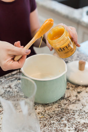Drizzle Turmeric Gold Raw Honey being used to bake a cake.