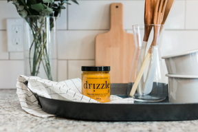 Turmeric Gold raw honey sitting on a kitchen counter