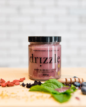 drizzle berry bliss honey on a cutting board