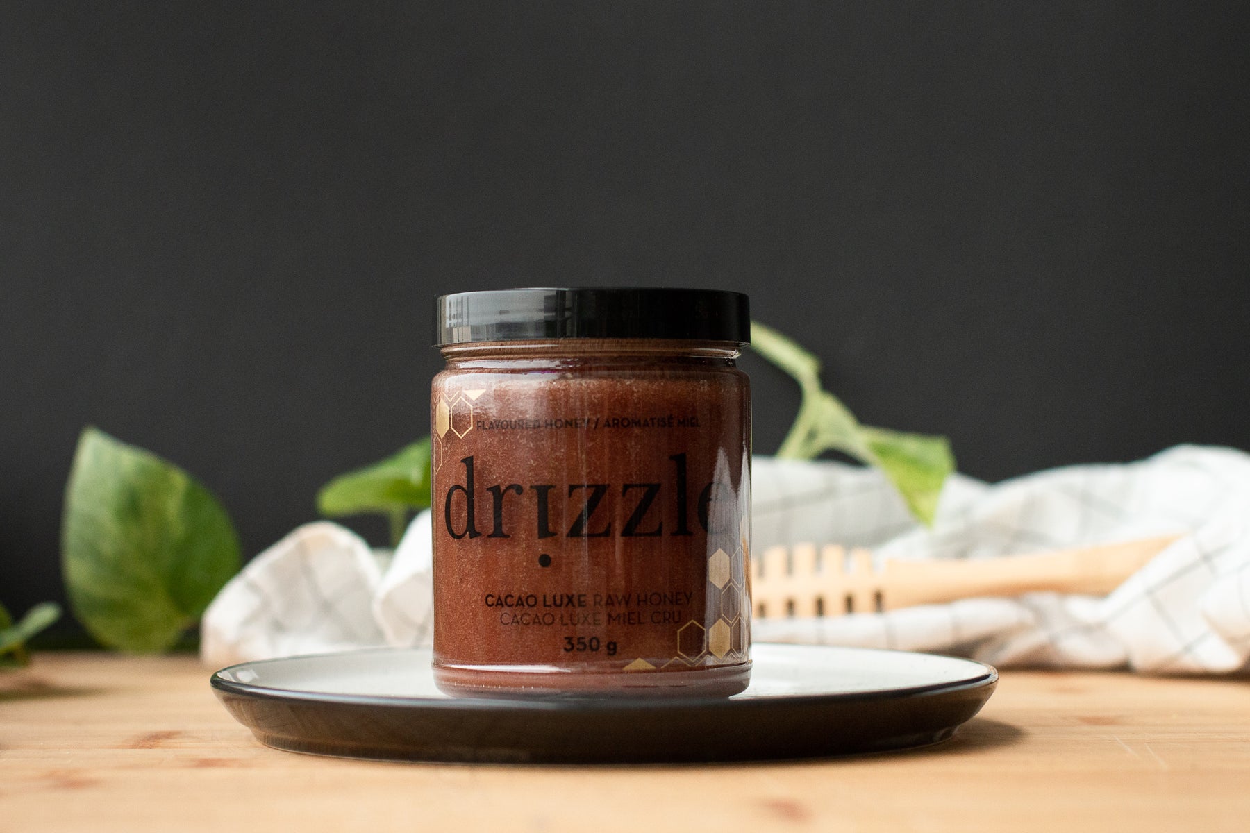 Photo of Drizzle Cacao Luxe Honey in a kitchen setting.