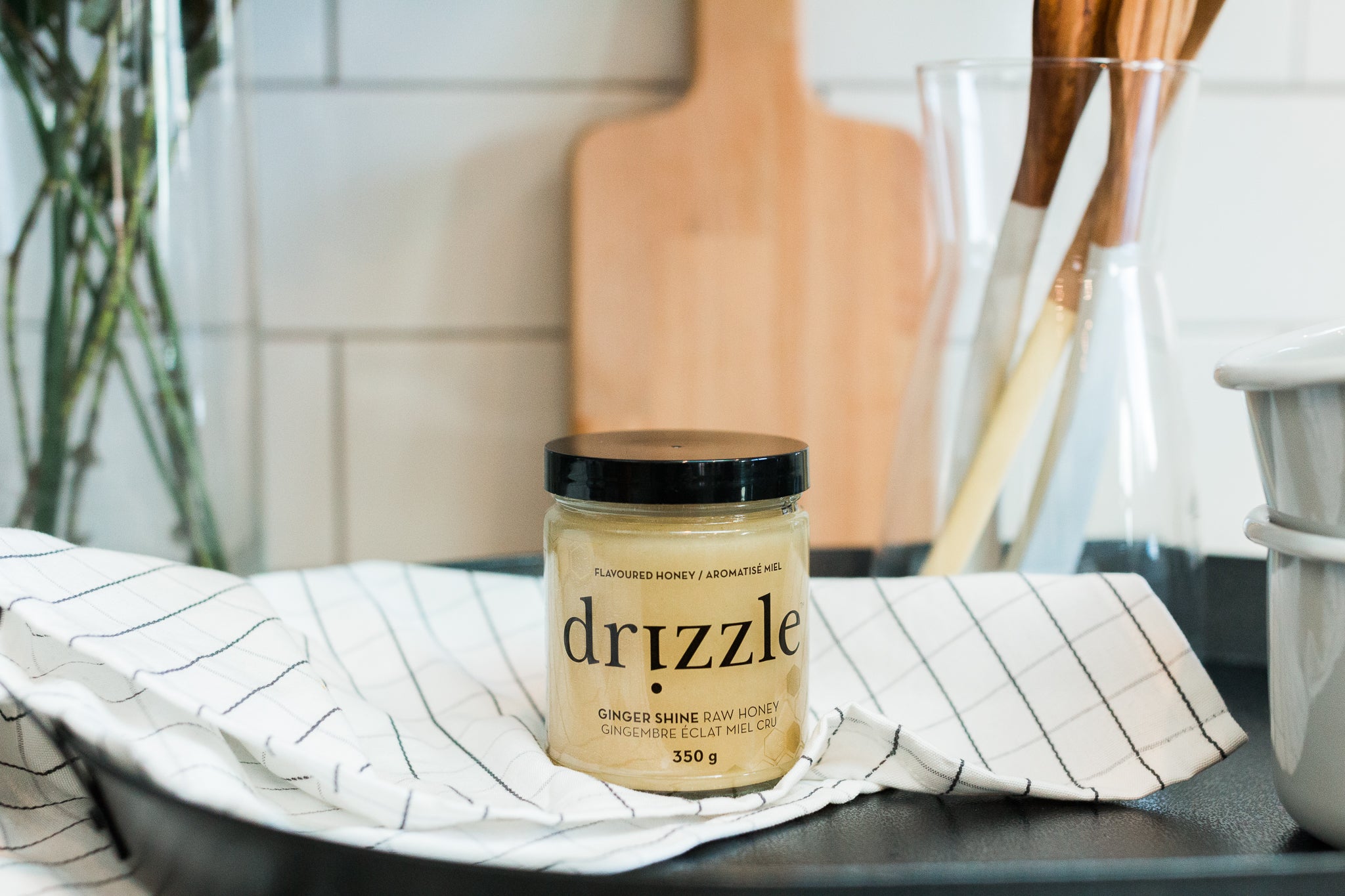 Drizzle Ginger Shine Raw Honey in a kitchen.